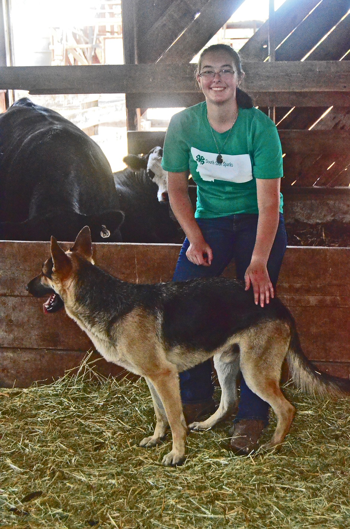 Anna with just some of her favorite animals. Wilson(dog), Donut and Lady in the background. (Erin Jusseaume/Clark Fork Valley Press)