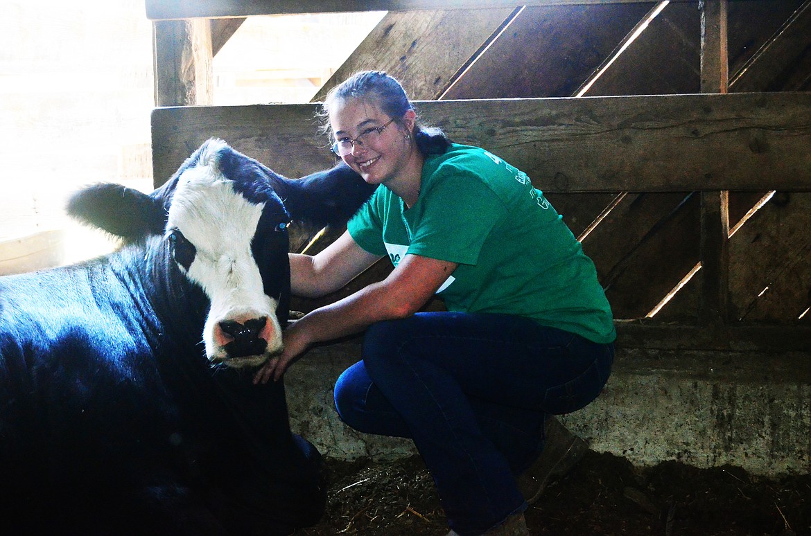 Lady ensuring she poses nicely with Anna for a photo. (Erin Jusseaume/Clark Fork Valley Press)