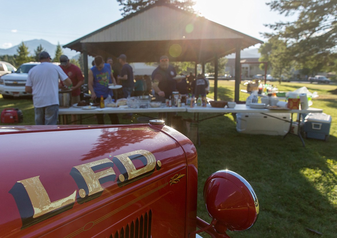 A firefighters&#146; barbecue isn&#146;t complete without an old-time fire engine. (John Blodgett/The Western News)