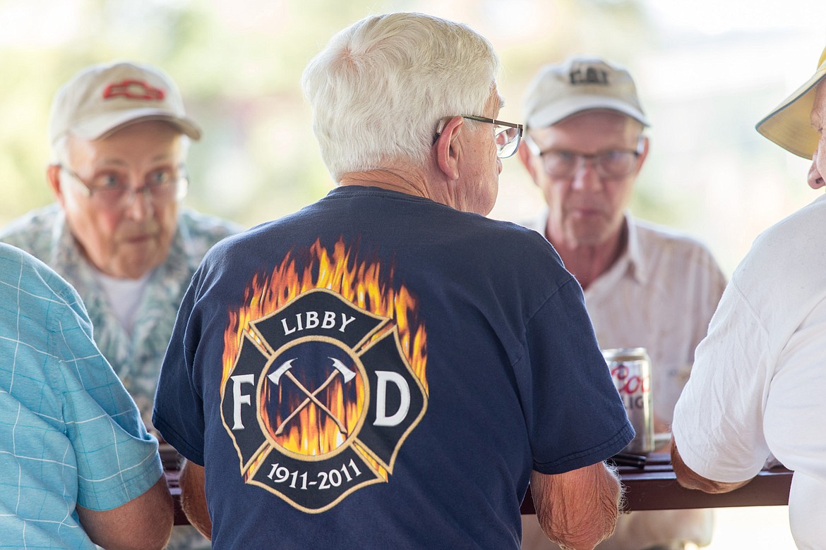 Retired firefighters, from left, Gary Swenson, Ken Preston,Terry Bennett and Dick Wood enjoy one another&#146;s company. Bennett is still active as secretary of the Rural Fire Board. (John Blodgett/The Western News)
