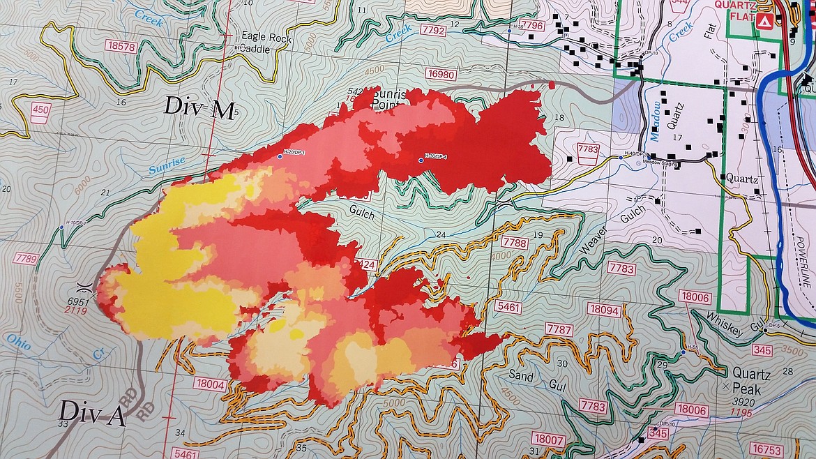 A map of the horseshoe-shaped Sunrise Fire burning east of Superior shows stages of the fire. Red is where the fire is most actively burning, yellow are areas of less activity. (Kathleen Woodford/Mineral Independent).