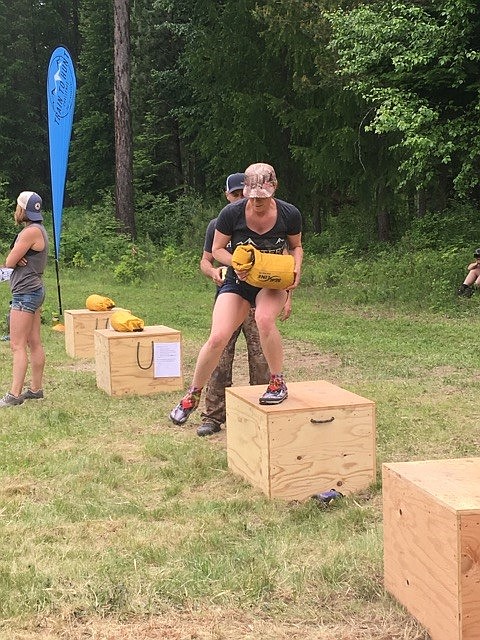 Below: District Qualifier Bench Overs. Women carried 30 pounds of sand over the 20 inch bench for 10 repetitions, and for 40 repetitions during Nationals.