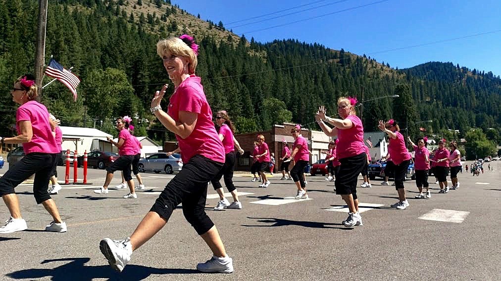 Photo by Larry Passantino. 
The Blazen Divias strut down Main Street in Mullan during the parade.