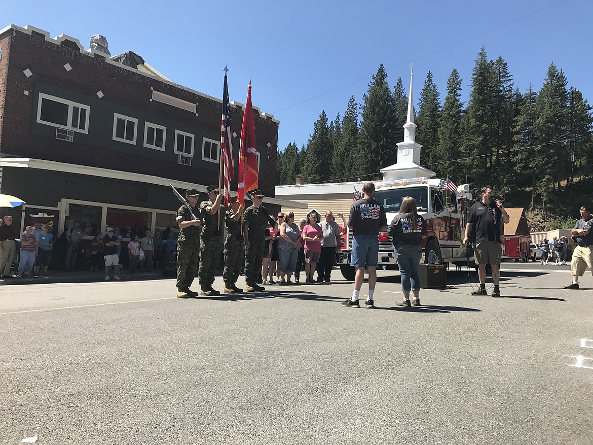 Photo by Tonia Foster. 
Kellogg JROTC presents the colors as MVFD Chief Pat Nolan (with assistance from Deanne Johnson and Chris Morris) presents memorial Fireman's flags and medals to the families of Roger Hoven and Daniel Erickson.