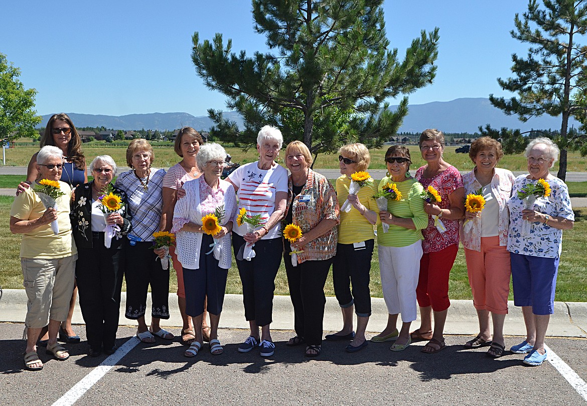 Members of the North Valley Hospital Auxiliary were honored at the hospital&#146;s picnic last week. The organization, which supported the hospital for 68 years, is ending. About 300 members have participated in the group over the years. Following the ceremony, North Valley CEO Chris Thomas, left back row, thanked each member for their support of the hospital. (Heidi Desch photos/Whitefish Pilot)