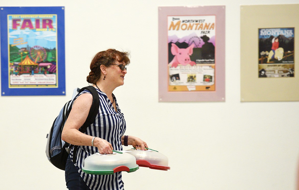 Mary-Anne Miller brings her entries to be judged in the pie contest at the Expo Center of the Flathead County Fairgrounds on Saturday. (Aaric Bryan/Daily Inter Lake)