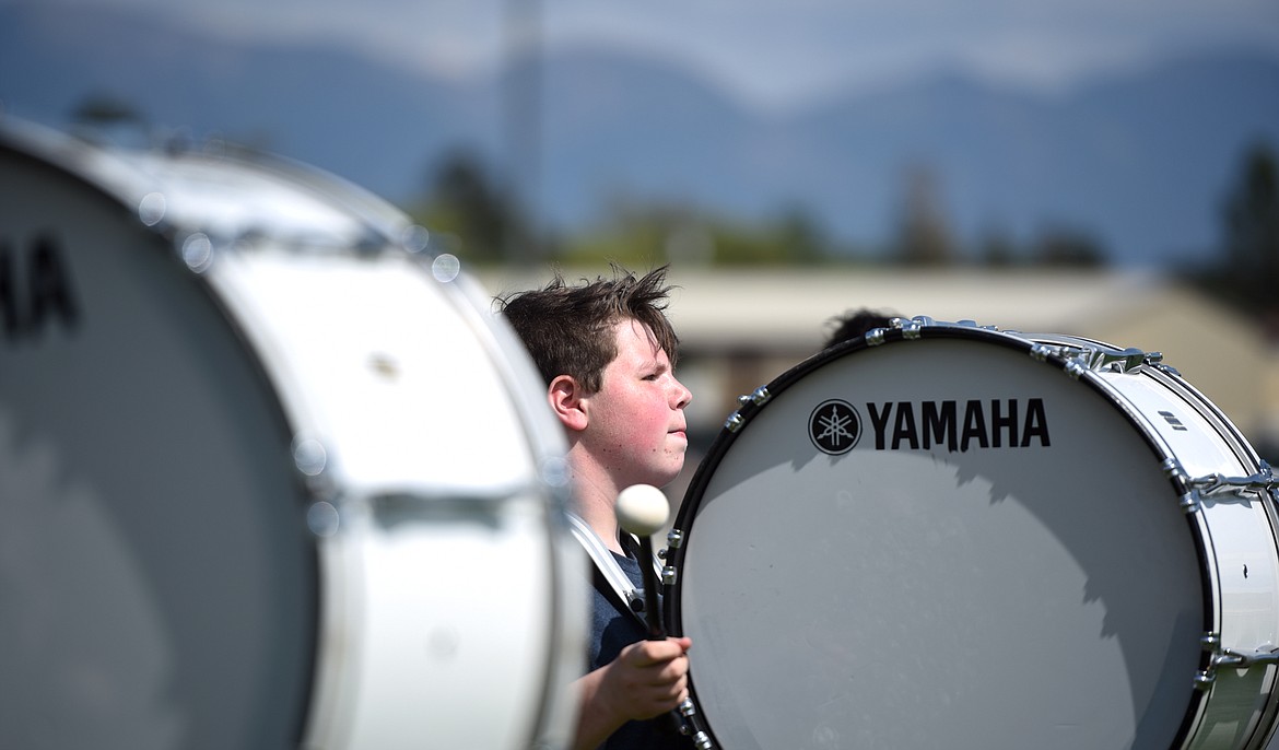 Flathead freshman Parker Stocklin and the Flathead High School Marching Band Drum Line practice for the parade on Thursday afternoon, August 17, at Legends Stadium.(Brenda Ahearn/Daily Inter Lake)