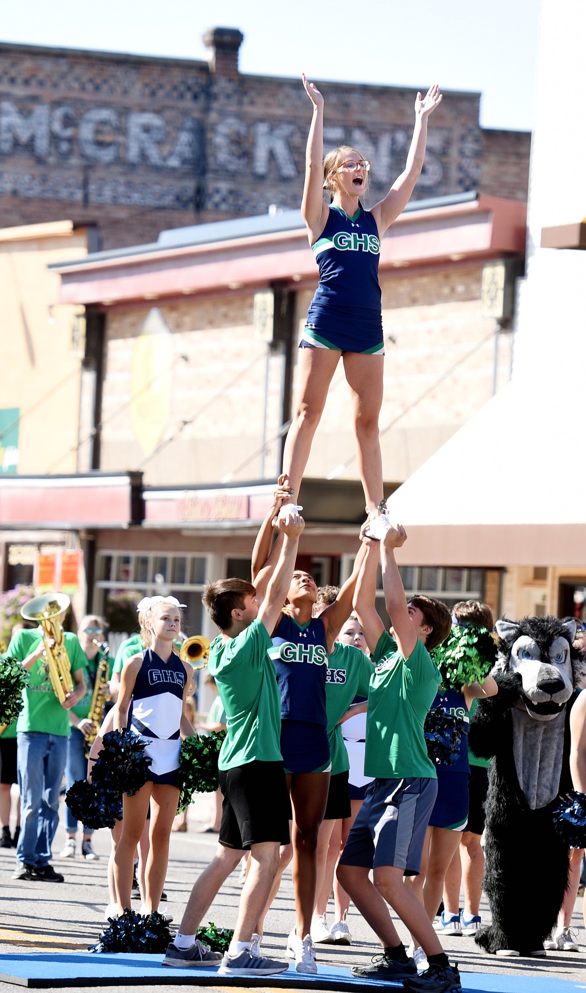 Cheerleaders from Glacier High School periodically stop along the parade route displaying some of their more vertical maneuvers for the crowd at the 2017 Northwest Montana Fair Parade on Friday morning, August 18, in downtown Kalispell.(Brenda Ahearn/Daily Inter Lake)