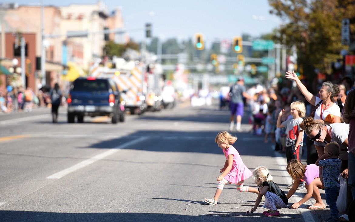 Kids collecting candy from the 2017 Northwest Montana Fair Parade on Friday morning, August 18, in downtown Kalispell.(Brenda Ahearn/Daily Inter Lake)