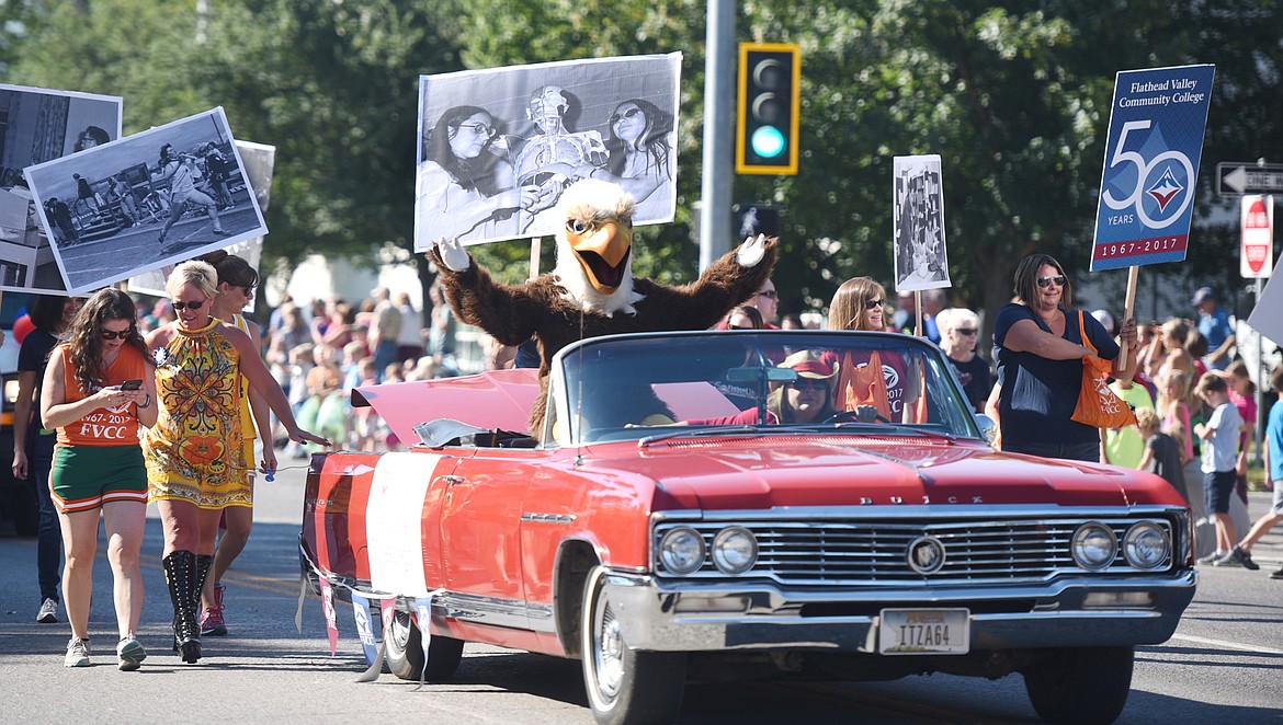 The float from Flathead Valley Community College, celebrating their 50th anniversary, makes its way down Main Street in the 2017 Northwest Montana Fair Parade on Friday morning, August 18, in downtown Kalispell.(Brenda Ahearn/Daily Inter Lake)