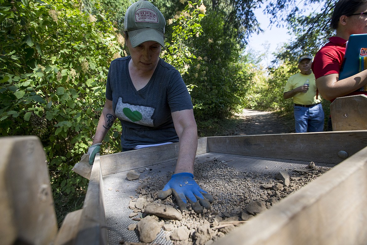 LOREN BENOIT/PressUniversity of Idaho archeology graduate student Marci Monaco screens dirt to find cultural material during an archeological dig Wednesday afternoon at Farragut State Park.