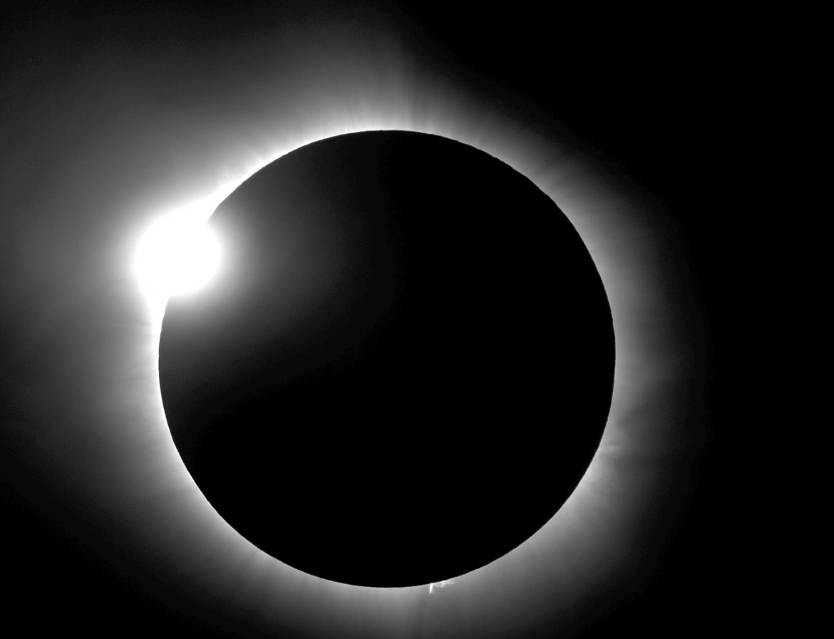 This photo provided by Bob Baer and Sarah Kovac, participants in the Citizen CATE Experiment, shows a &#147;diamond ring&#148; shape during the 2016 total solar eclipse in Indonesia. For the 2017 eclipse over the United States, the National Science Foundation-funded movie project nicknamed Citizen CATE will have more than 200 volunteers trained and given special small telescopes and tripods to observe the sun at 68 locations in the exact same way. The thousands of images from the citizen-scientists will be combined for a movie of the usually hard-to-see sun&#146;s edge. (R. Baer, S. Kovac/Citizen CATE Experiment via AP)