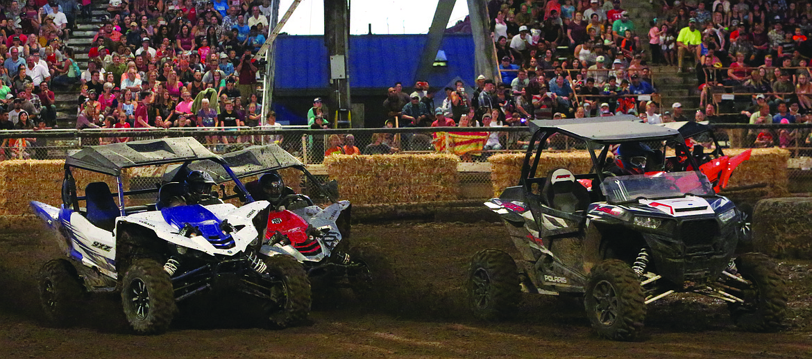 Connor Vanderweyst/Columbia Basin Herald
UTVs race at the Moses Lake Demolition Derby.