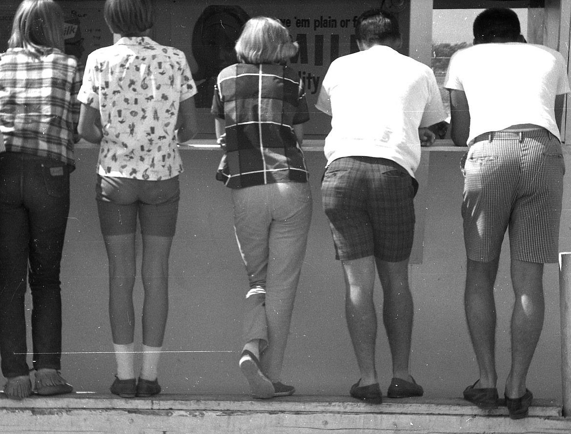 The more things change, the more they stay the same. A food booth at the Northwest Montana Fair in 1967 draws a line of thirsty patrons.
