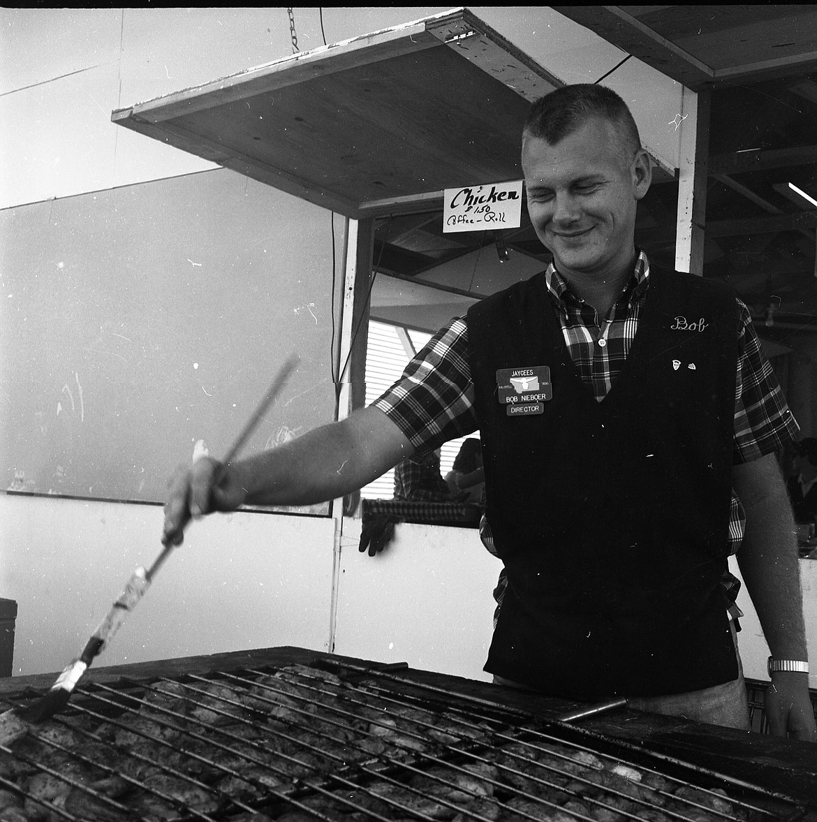 Bob Nieboer of the Jaycees was a grillmaster at the Northwest Montana Fair in 1967.