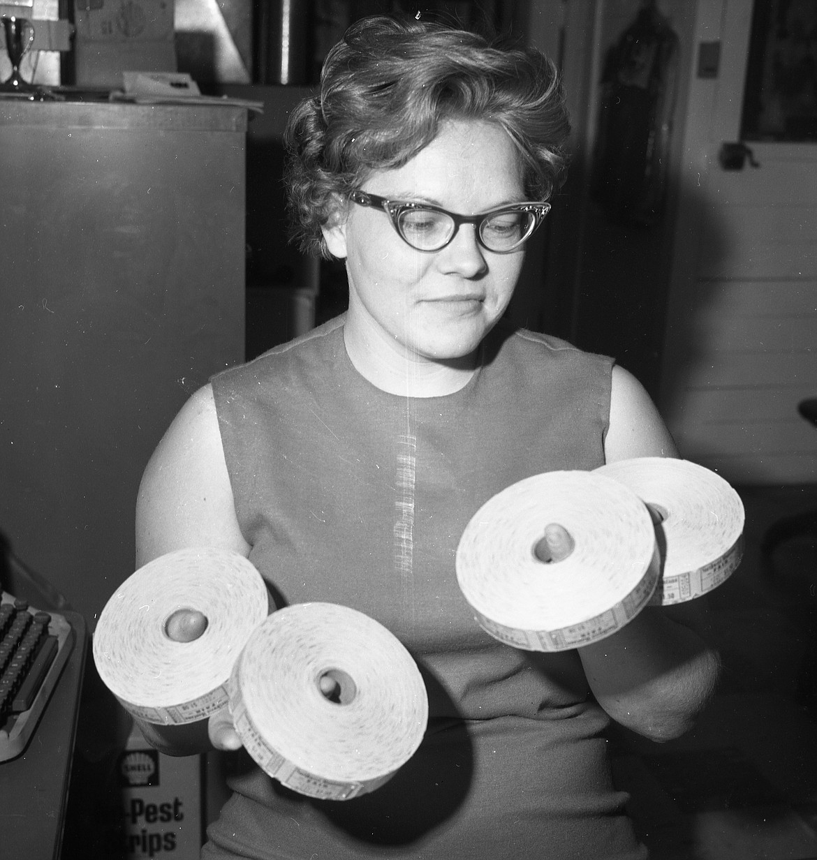 Mrs. Darel Hansen, Kalispell, holds 4,000 of the 28,000 tickets the Northwest Montana Fair and Rodeo hoped to sell in 1967.