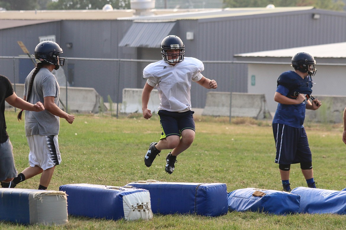 Nathan Varelman tackles his football training with enthusiasm under coach Cory Kramer.