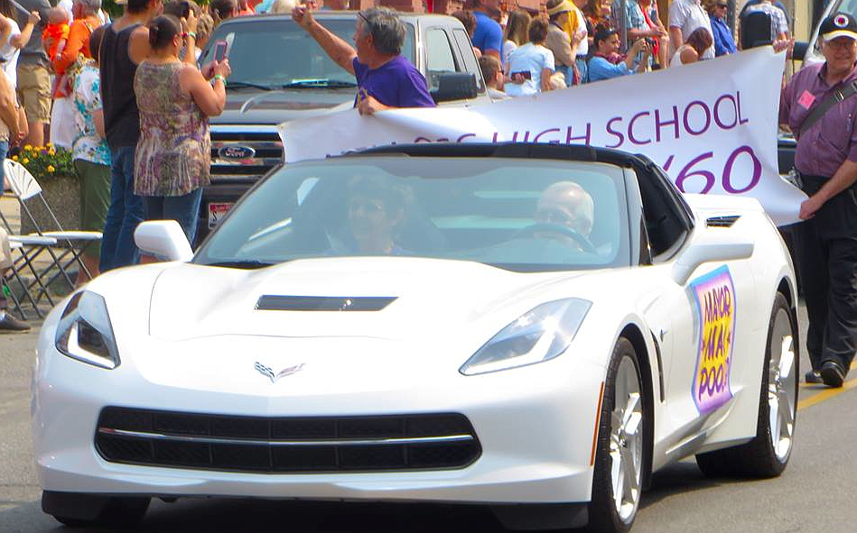 Kellogg mayor and KHS graduate Mac Pooler with his wife drive a Corvette during the parade.