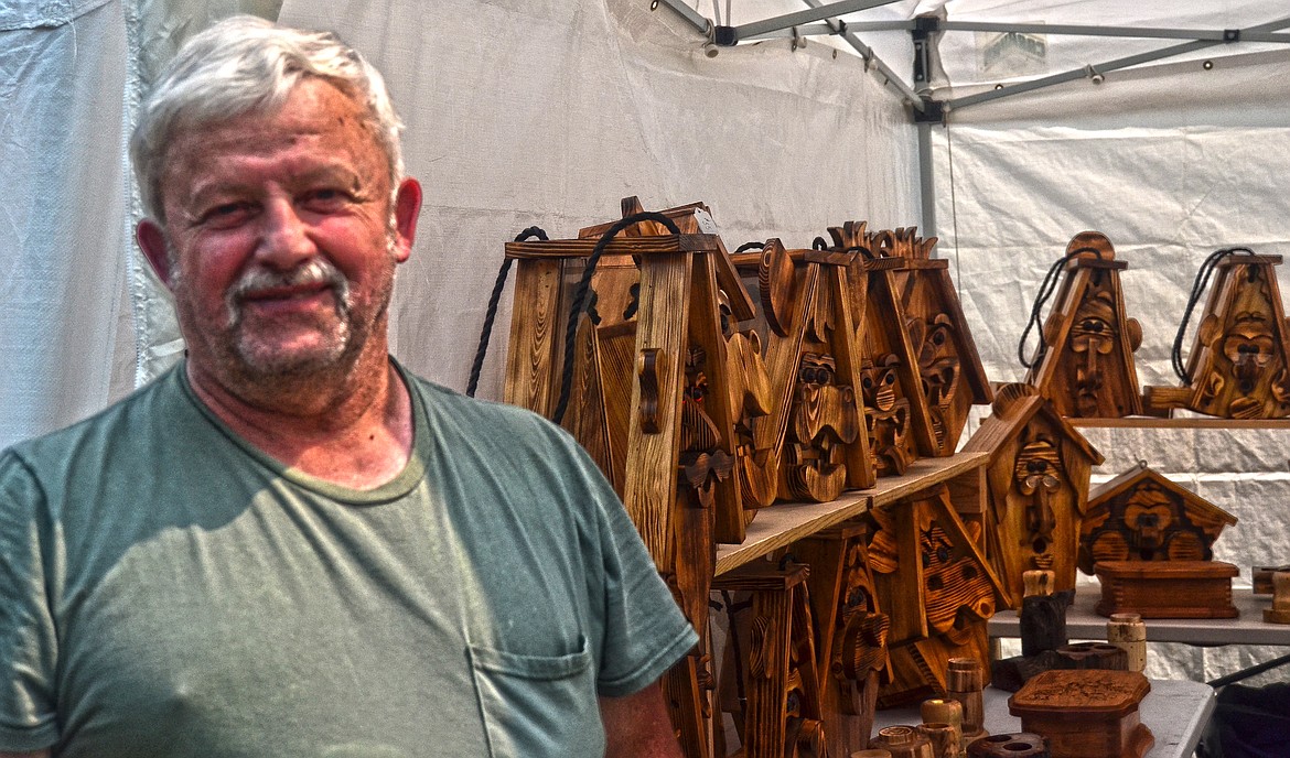 Ed Mueli of Kalispell with his hand made bird houses on display at the festival. Photo Credit Erin Jusseaume Clark Fork Valley Press