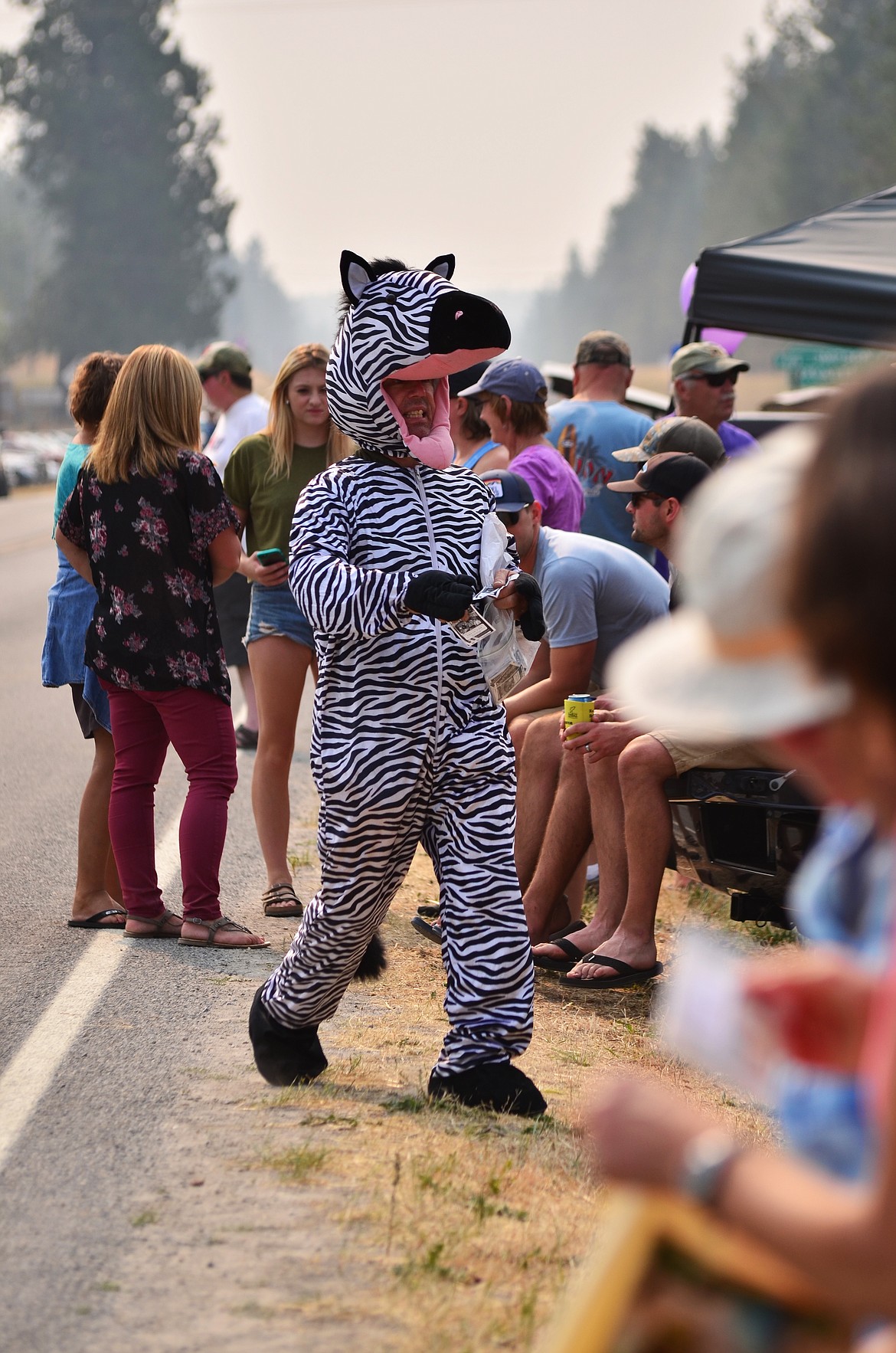 Keith Meyers of Libby was passing out flyers for the Caveman of the Kootenai performance on Sunday. Photo Credit Erin Jusseaume Clark Fork Valley Press