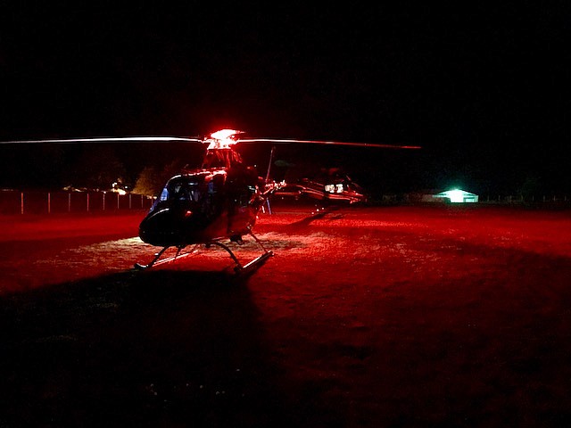 Photo courtesy of Shoshone County Fire District No.1/
Life Flight and Two Bear Air helicopters on the ground at Sather Field. This is where Howard was transfered from one helicopter to the other.