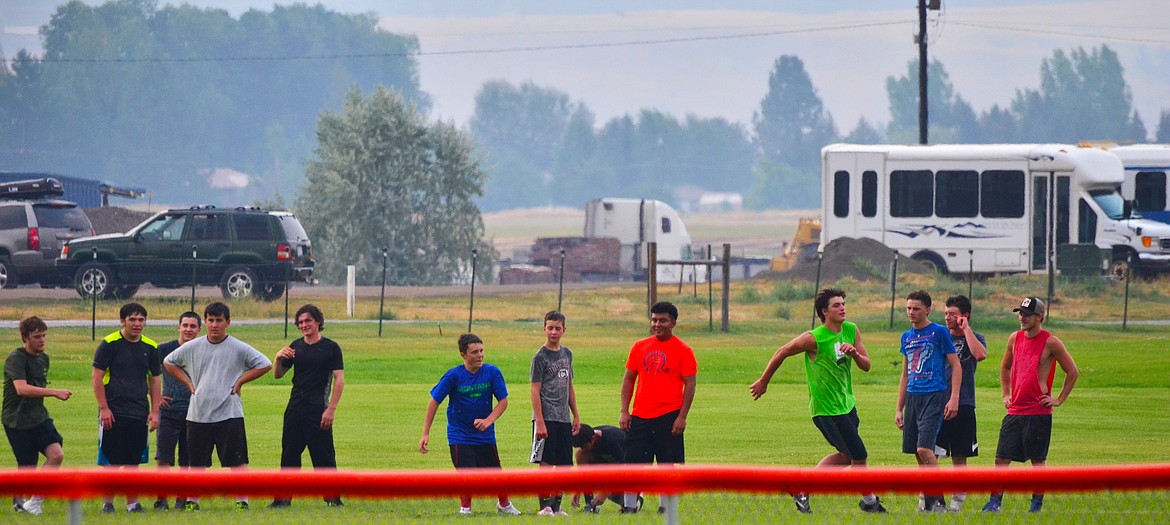 Running drills at the second practice for the day. Photo Credit Erin Jusseaume Clark Fork Valley Press