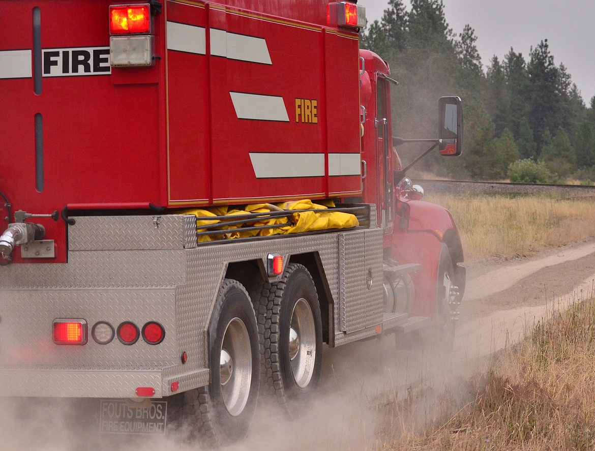 Plains Rural Fire Department making their way to the grass fire this weekend. (Erin Jusseaume/Clark Fork Valley Press)