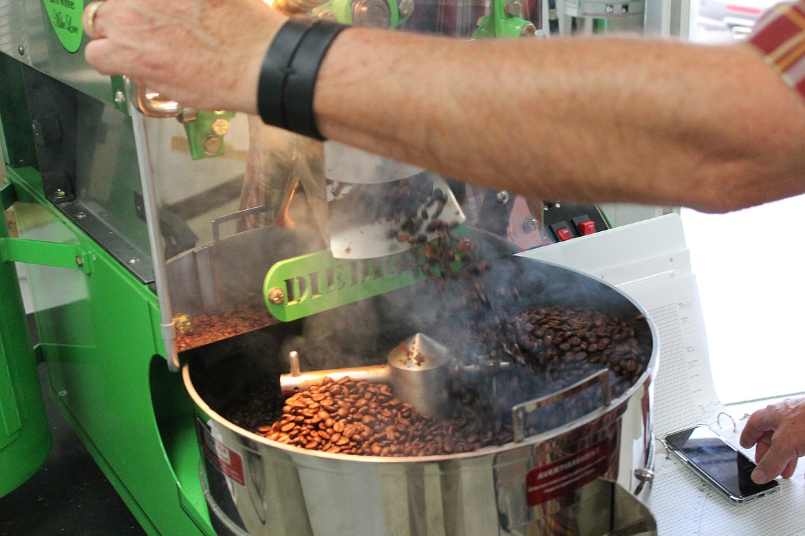 Charles H. Featherstone/The Columbia Basin HeraldDark Mexican coffee beans tumble out to cool.