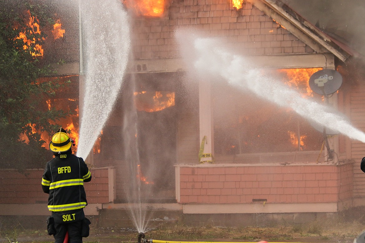 Photo by Mandi Bateman
Firefighters keep the controlled blaze at bay.