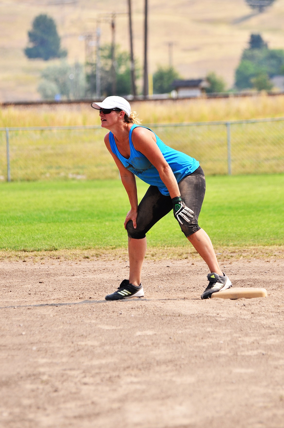 Kim Bergstrom sitting on second base after a slide Photo Credit Erin Jusseaume Clark Fork Valley Press