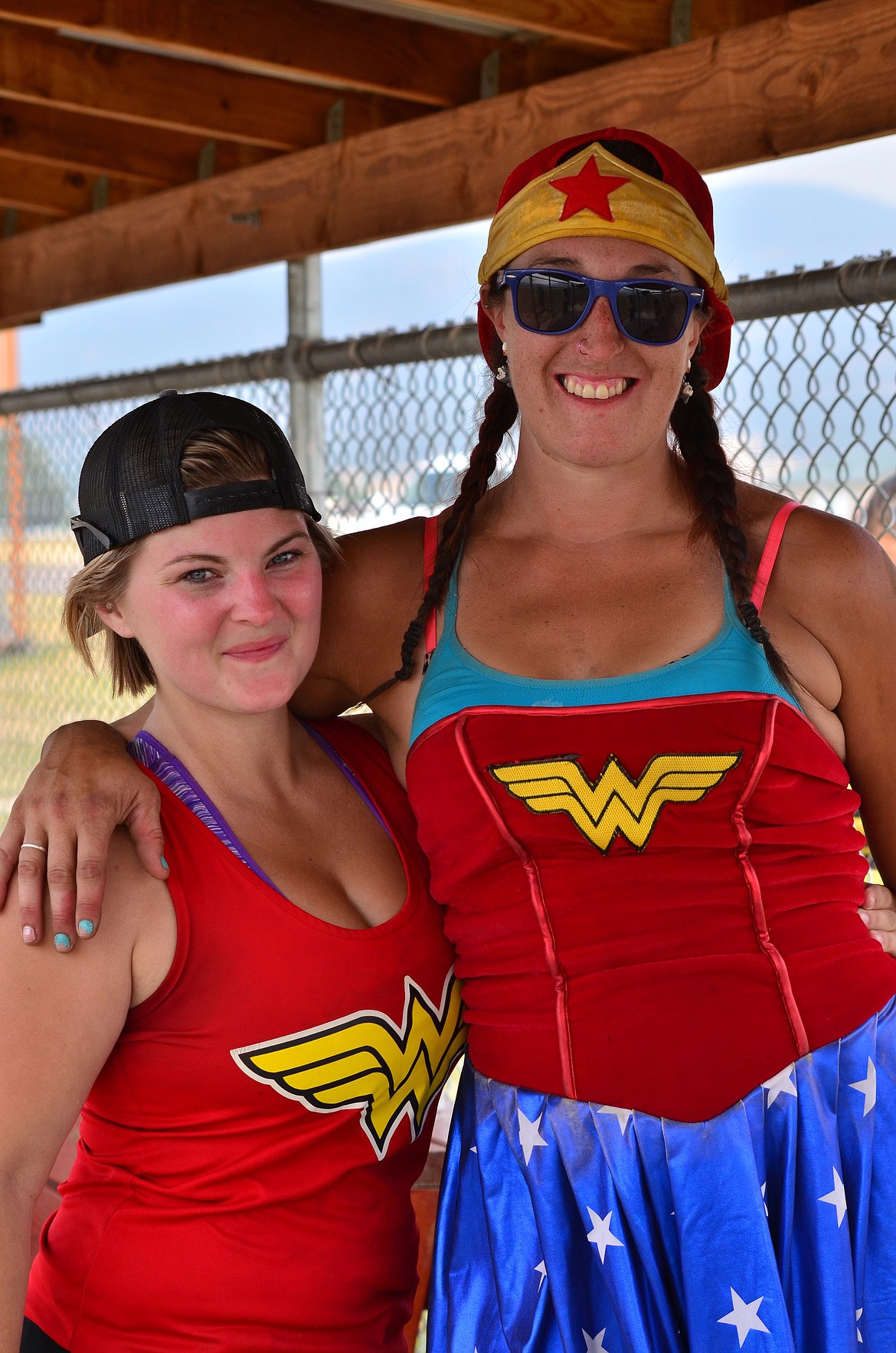 Softball players from the Super Heroes team Melody Earhart (L) Keera Ackley (R) enjoying the tournament here in Plains. Photo Credit Erin Jusseaume Clark Fork Valley Press