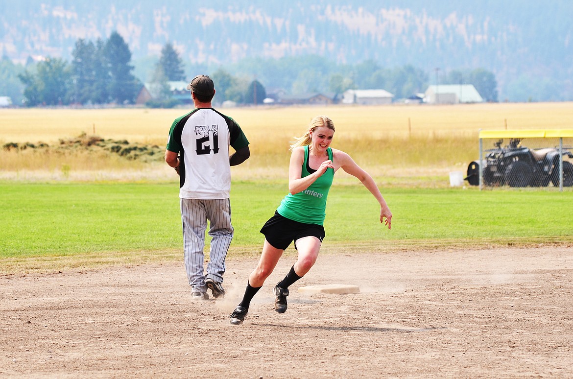 Katie K running through second base, Neiman Wilson fielding. Photo Credit Erin Jusseaume Clark Fork Valley Press