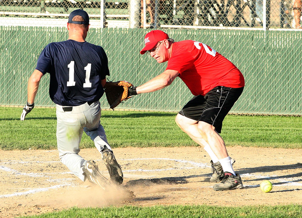 File photo
MLFD catcher Andy Grenier&#146;s heart was in the right place in this play at last year&#146;s Battle of the Badges, even if the ball was not. This year&#146;s event is tonight.