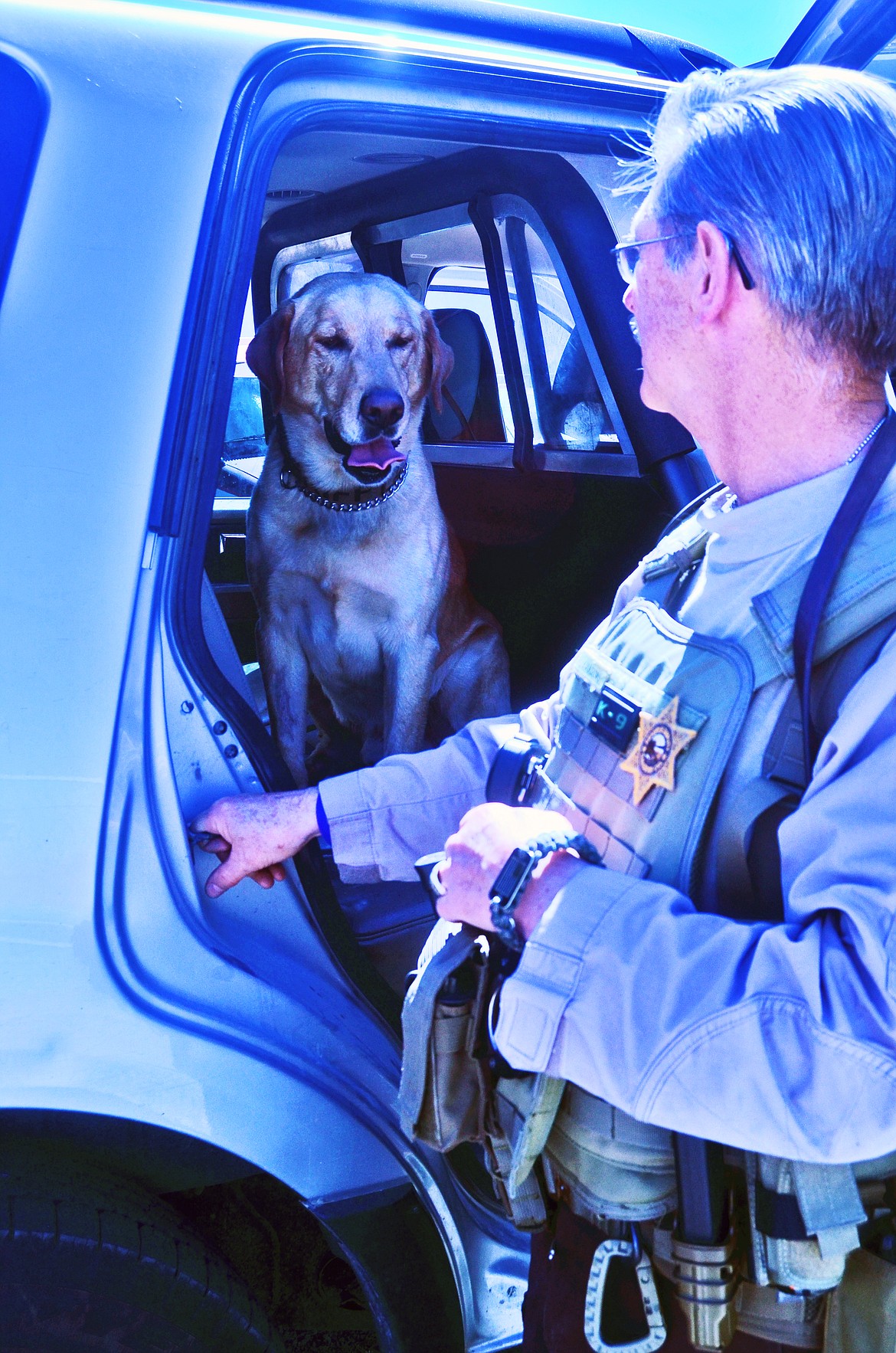 The team of Max and handler Lynn Lanzoni takess a water break between simulated tests, so they don&#146;t get overheated or exhausted. (Erin Jusseaume/Clark Fork Valley Press)