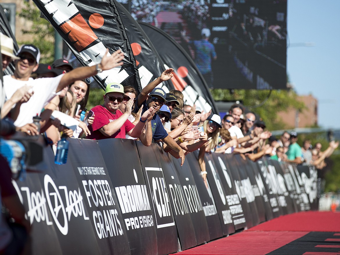 LOREN BENOIT/Press

The crowd watches cheers on first place overall Ironman Coeur d&#146;Alene athlete Mark Saroni.