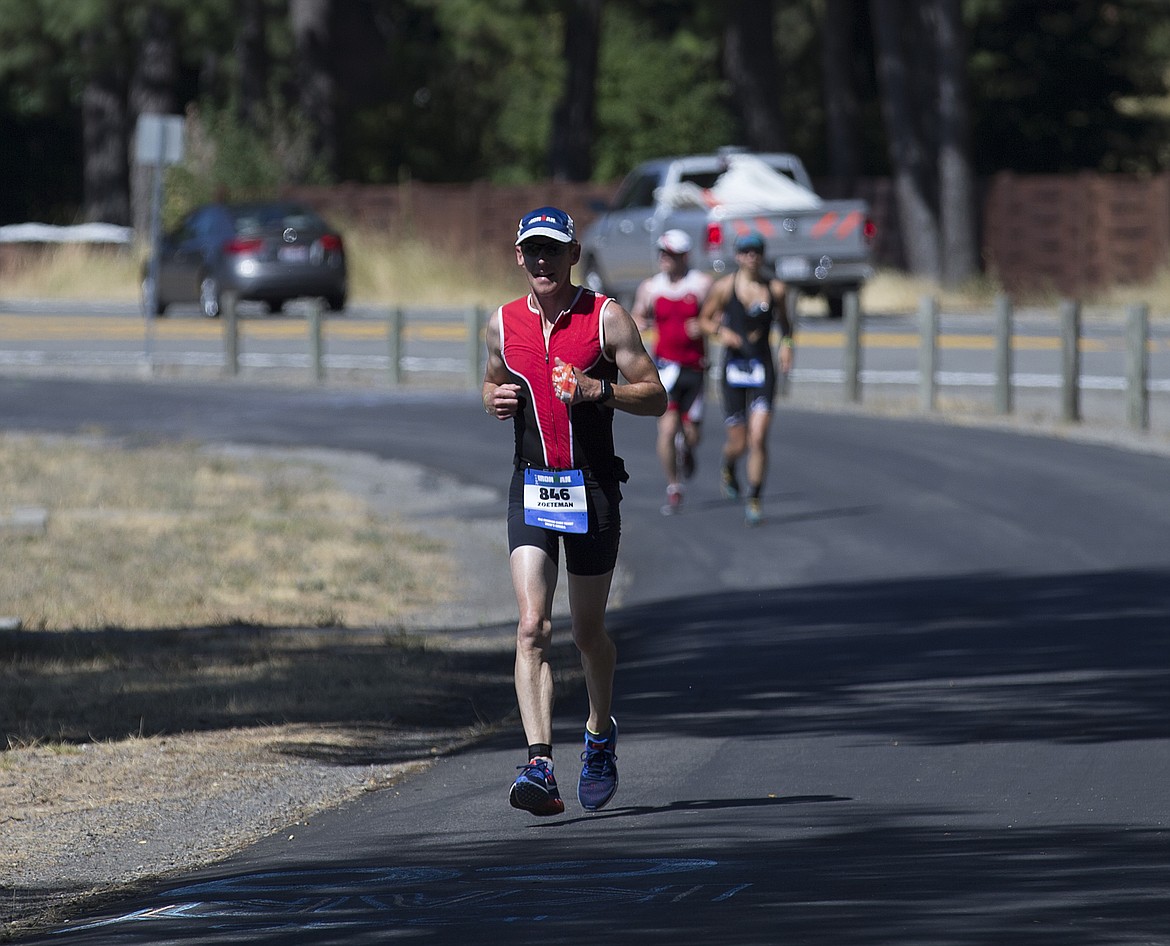 LOREN BENOIT/Press

Jason Zoeteman, of Calgary, Alberta runs the North Idaho Centennial Trail out to Higgins Point Sunday afternoon during Ironman Coeur d&#146;Alene.