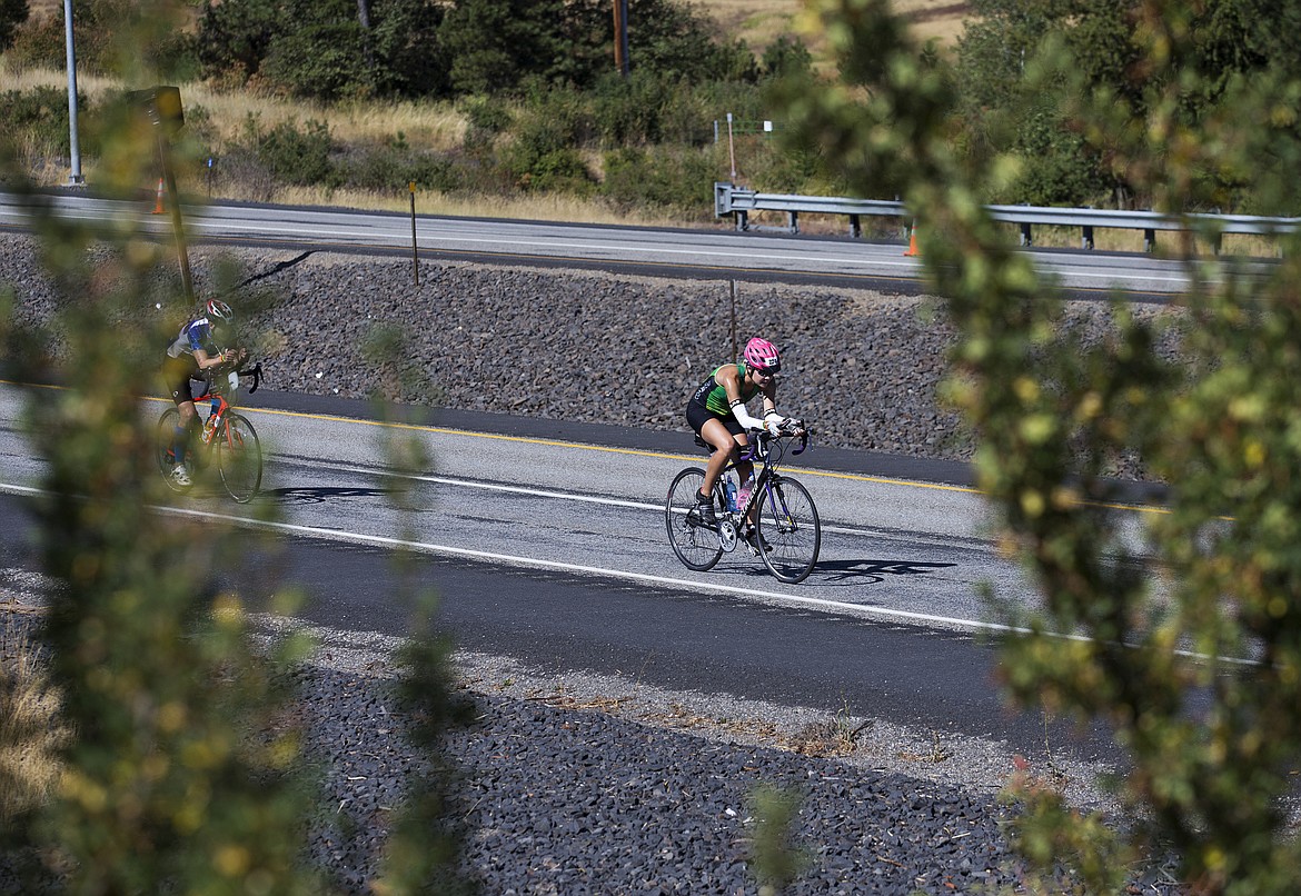 LOREN BENOIT/Press

Sydney Smyly, of Coeur d&#146;Alene, Idaho bikes north on U.S. 95 during Ironman Coeur d&#146;Alene on Sunday.