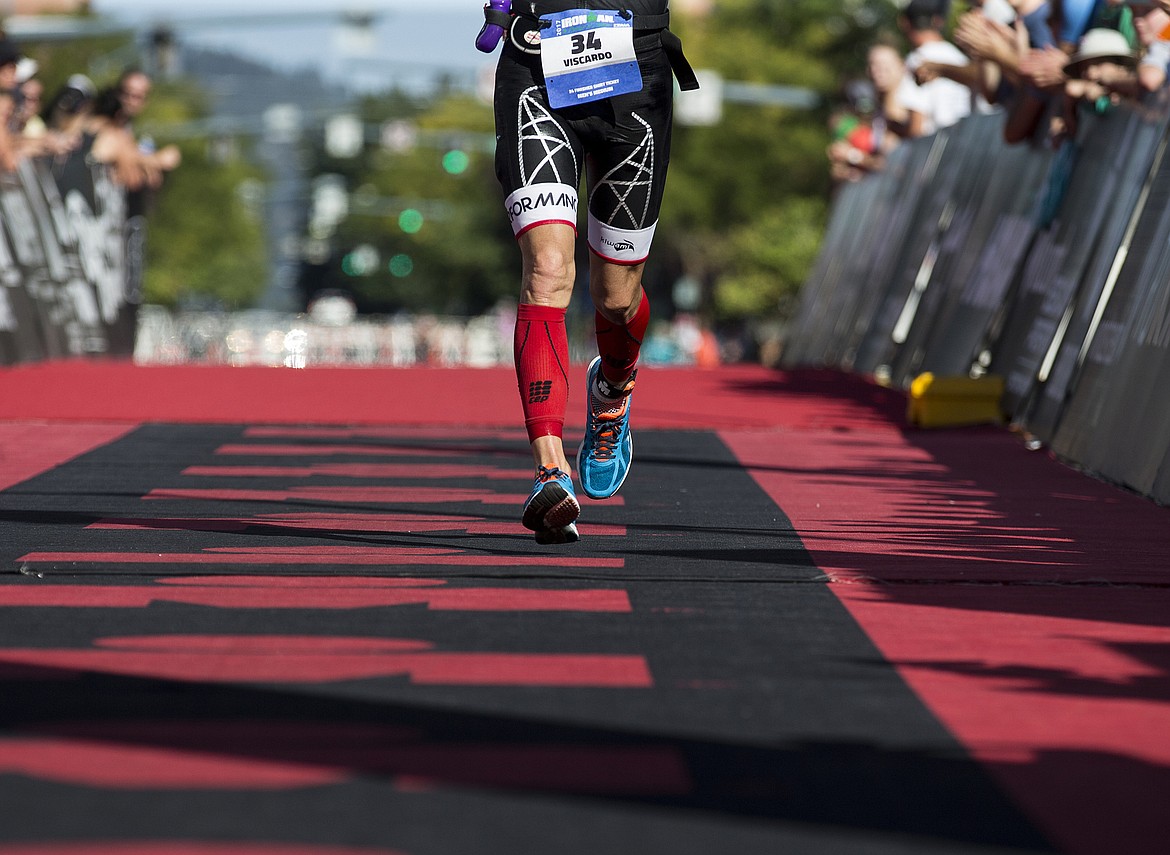 LOREN BENOIT/Press

Peter Viscardo runs the tunnel to the Ironman Coeur d&#146;Alene finish line.