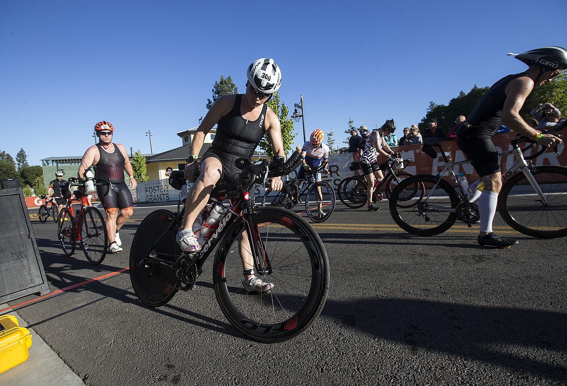 LOREN BENOIT/Press

Kenny O&#146;Connor-Park and other Ironman Coeur d&#146;Alene athletes mount their bikes to begin the bike portion of the race.