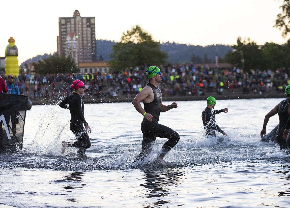 LOREN BENOIT/Press

Zachary Bunkley, of Renton, Wash. rushes into the water for the 2.4 mile Ironman Coeur d&#146;Alene swim.