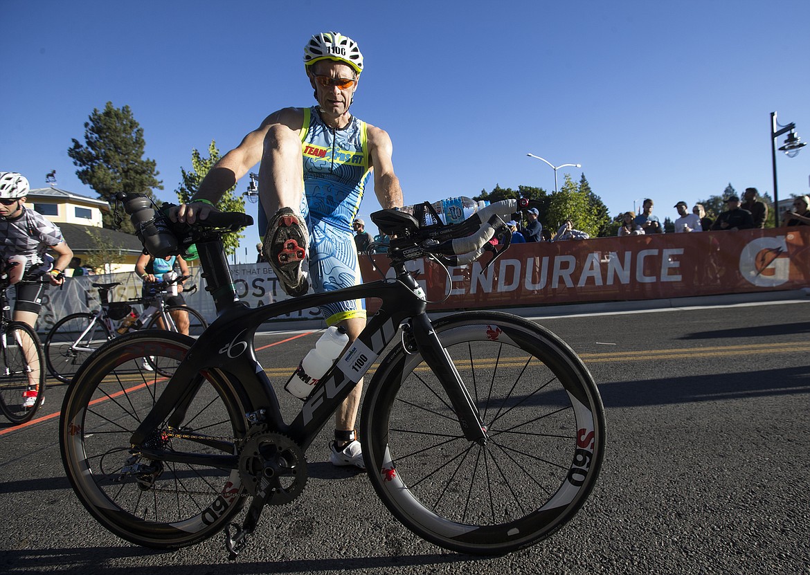 LOREN BENOIT/Press

Richard Snider, of Vincennes, Ind. mounts his bike to begin the Ironman Coeur d&#146;Alene bike race.