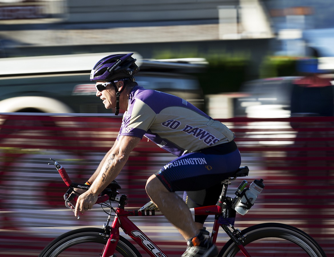 LOREN BENOIT/Press

Gary Mullen, of Wenatchee, Wash. speeds through downtown Coeur d&#146;Alene during Ironman.