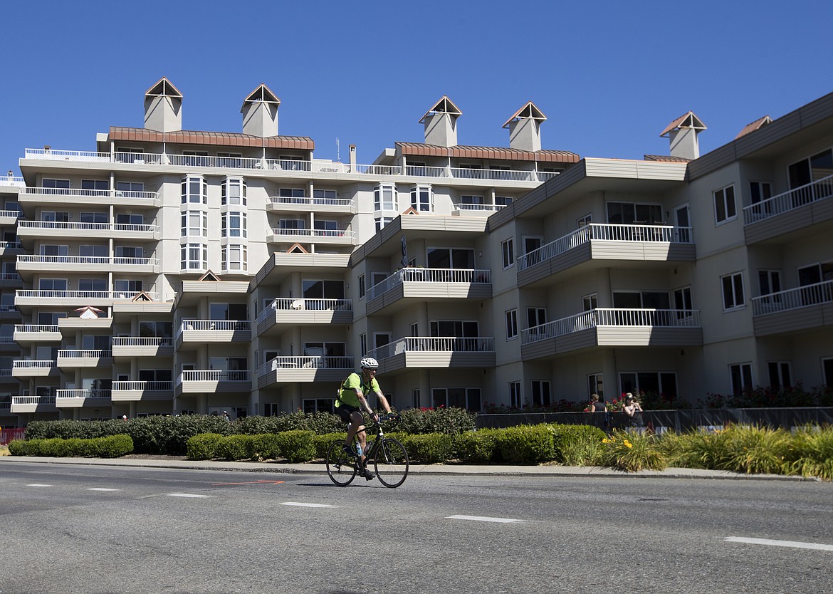 LOREN BENOIT/Press

James Buechner III, of Evanston, IL. cycles by the Coeur d&#146;Alene North Condos during Ironman Coeur d&#146;Alene on Sunday.