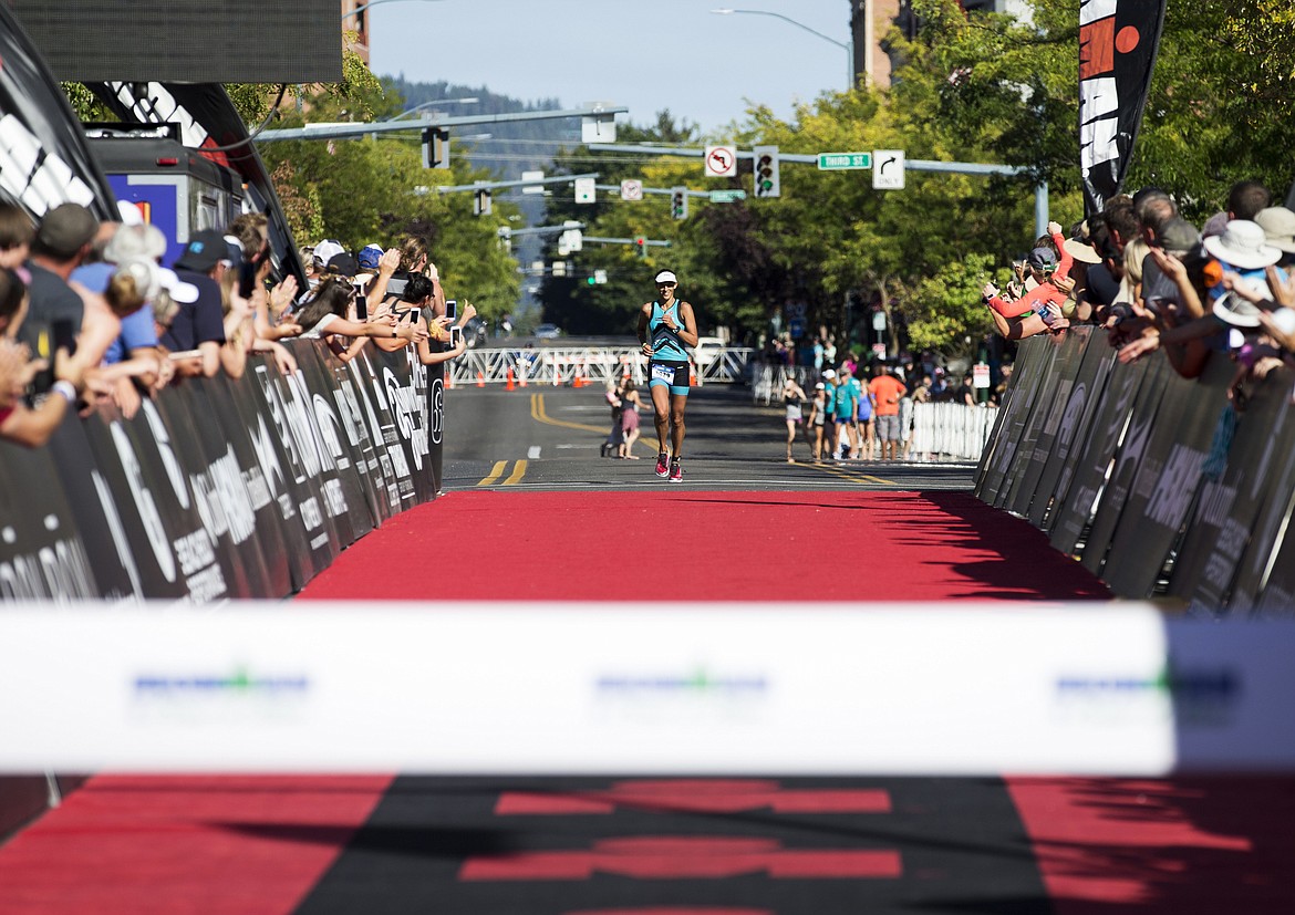 LOREN BENOIT/Press

First place womens finisher Hayley Cooper-Scott, of Spokane, Wash. approaches the Ironman Coeur d&#146;Alene finish line.