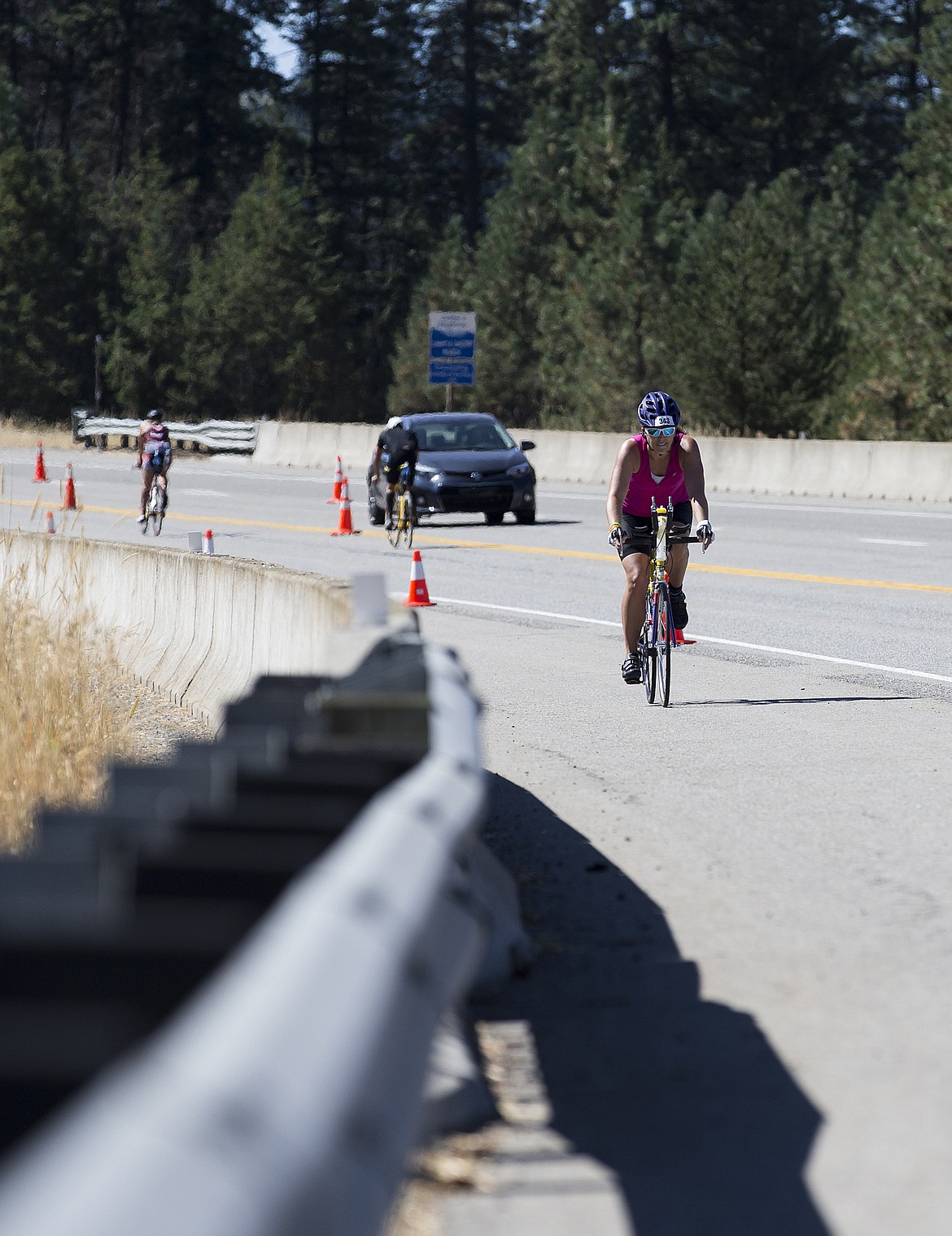 LOREN BENOIT/Press

April Kuntz, of Claresholm, Alberta rides her bike down Mica Grade during Ironman Coeur d&#146;Alene.