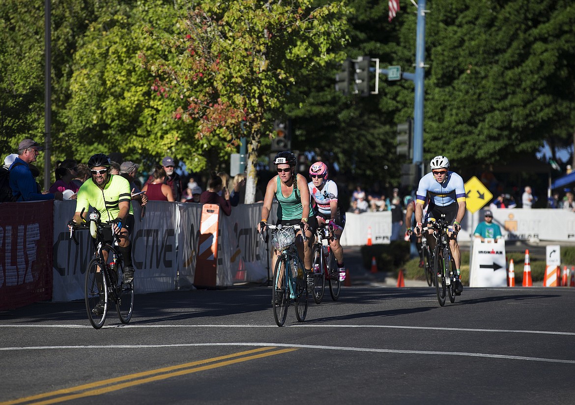 LOREN BENOIT/Press

Jenny Hazel, of Bellevue, Wash. and other athletes bike Lakeside Avenue during Ironman Coeur d&#146;Alene.