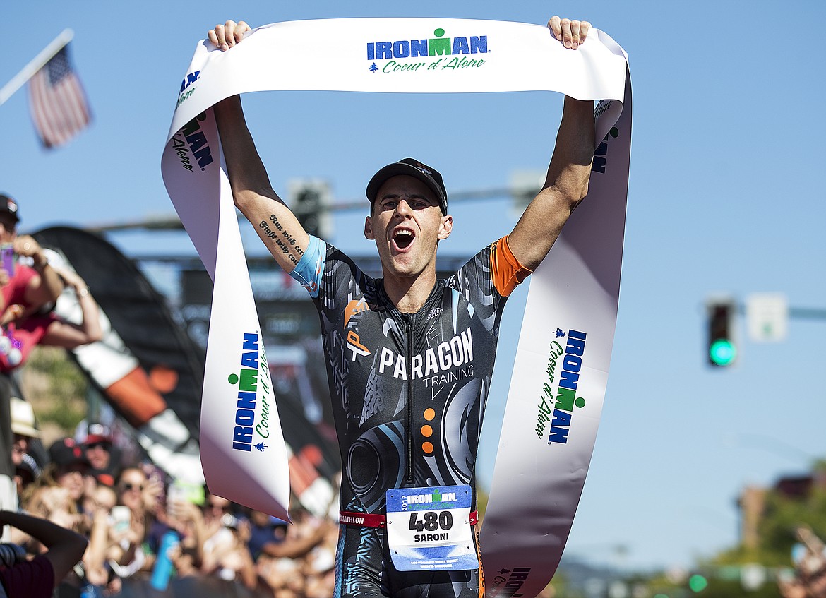 LOREN BENOIT/Press

Mark Saroni, of San Antonio, Texas raises the first place overall ribbon after crossing the Ironman Coeur d&#146;Alene finish. Saroni finished with a time of 9 hours, 29 minutes and 52 seconds.