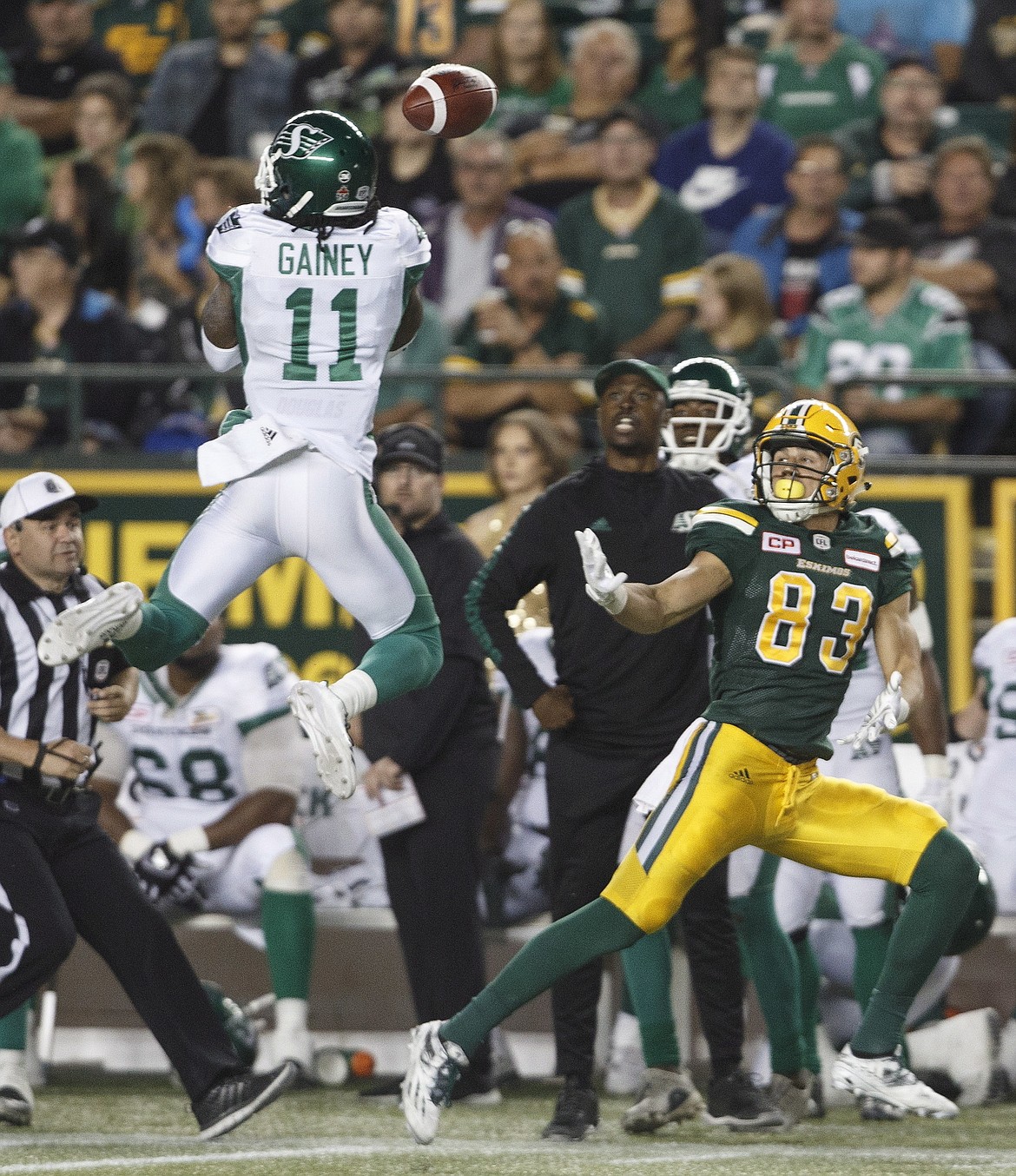 Saskatchewan Roughriders&#146; Ed Gainey (11) blocks a pass to Edmonton Eskimos&#146; Brandon Zylstra (83) during the second half of a Canadian Football League game in Edmonton, Alberta, Friday Aug. 25, 2017. (Jason Franson./The Canadian Press via AP)