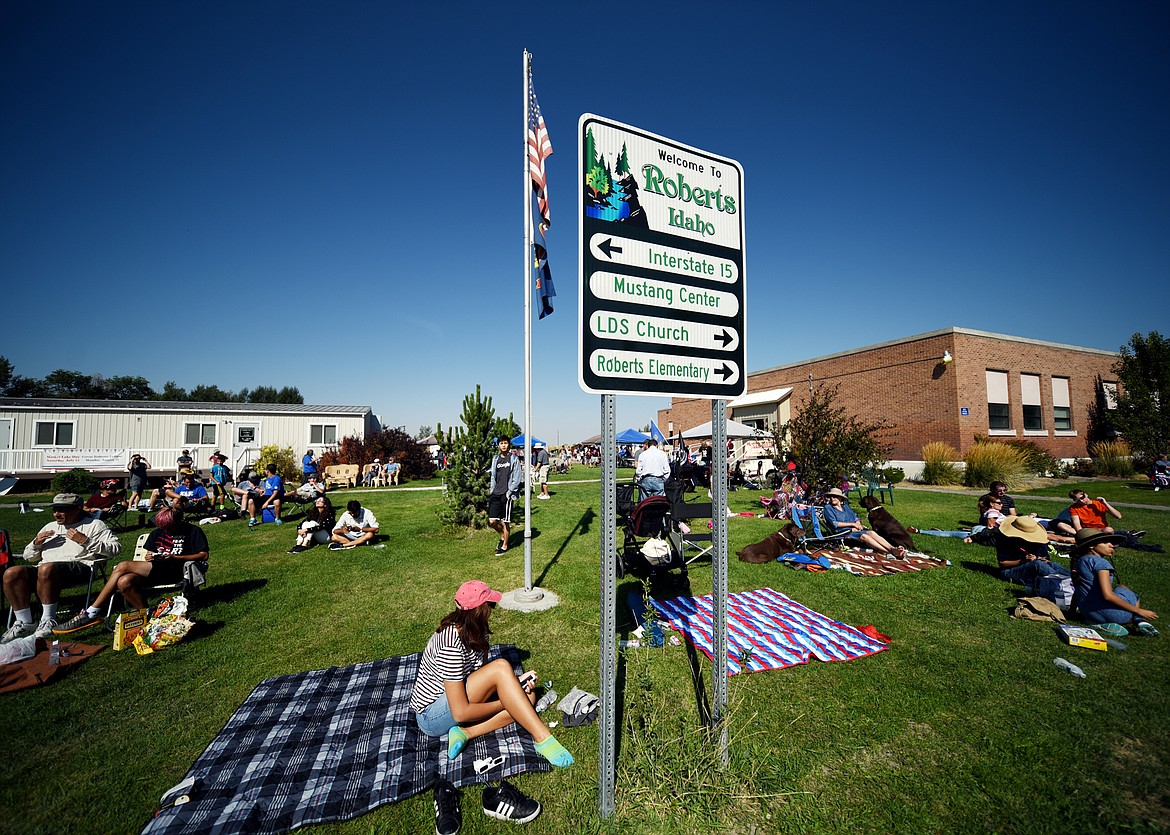 The park in Roberts begins to starts to fill up as people gather for the total eclipse at 11:32 a.m. on Monday, August 21. At the moment of totality a collective shout went up from the crowd that was heard four blocks away.(Brenda Ahearn/Daily Inter Lake)