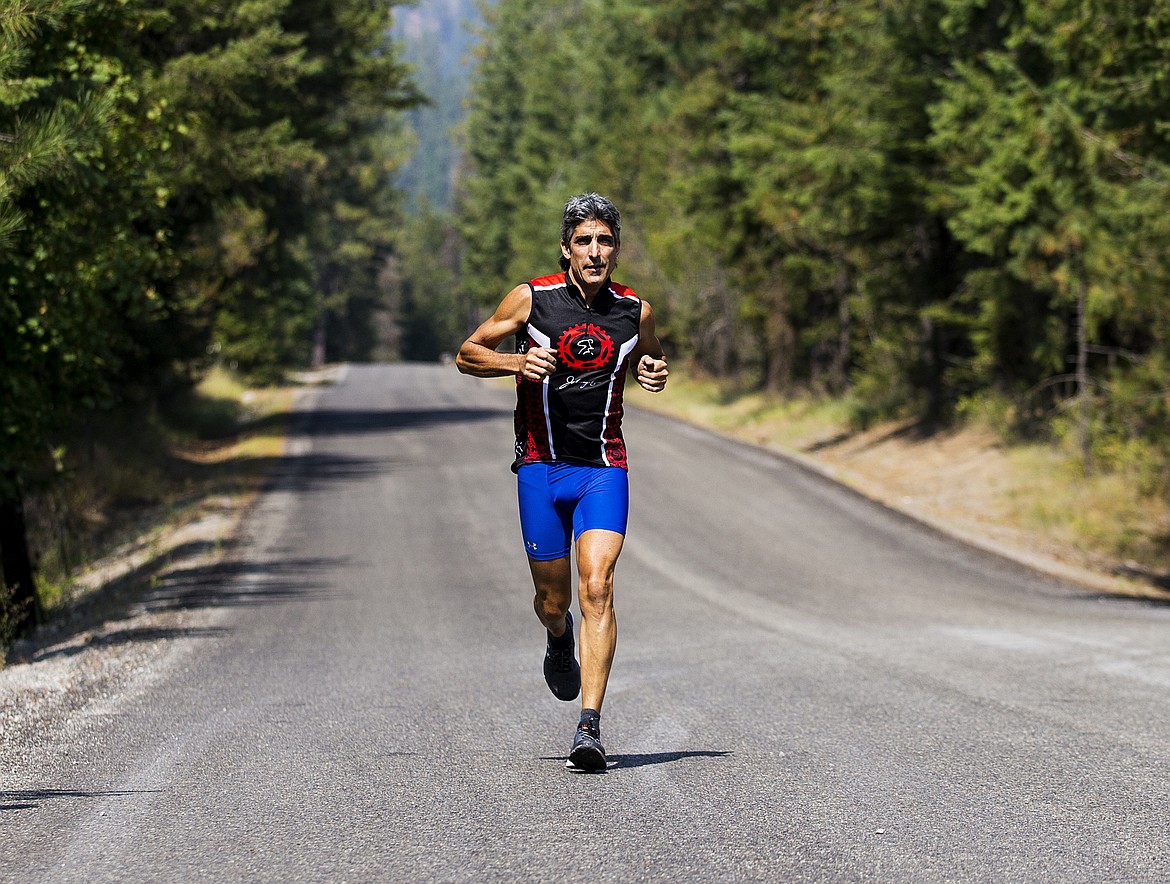 LOREN BENOIT/Press

Rodkey Faust runs on a road Wednesday afternoon in Twin Lakes in preparation for Sunday&#146;s Ironman.